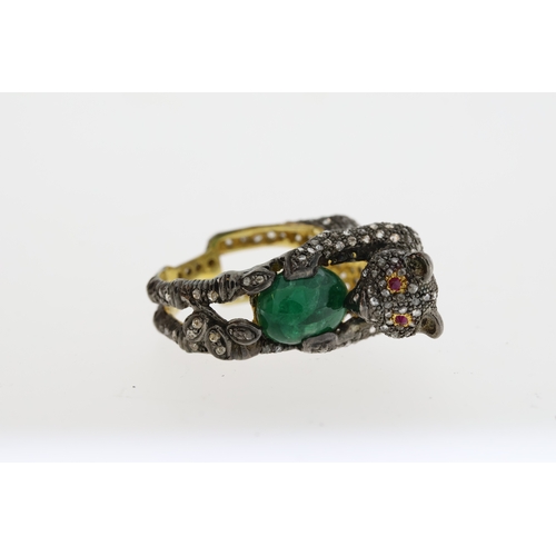 1087 - Unusual silver gilt panther ring heavily-set with diamonds. The panther is holding an oval emerald a... 