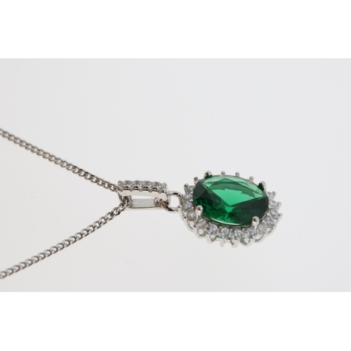 1090 - Silver necklace comprising oval green CZ with white CZ halo pendant and chain