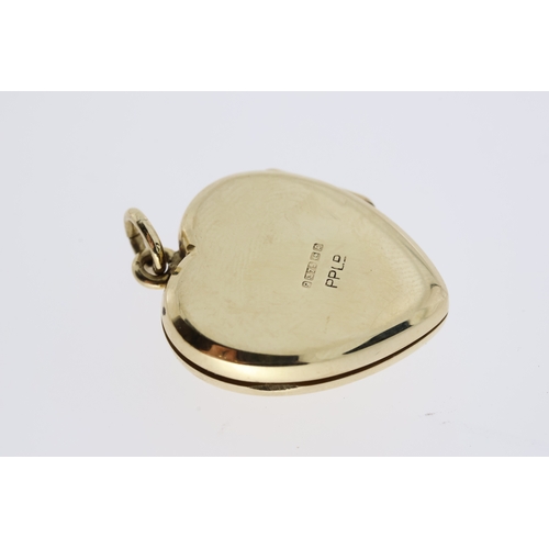 1093 - Hallmarked 375/9ct yellow gold opening heart locket with removable heart frames inside to allow phot... 