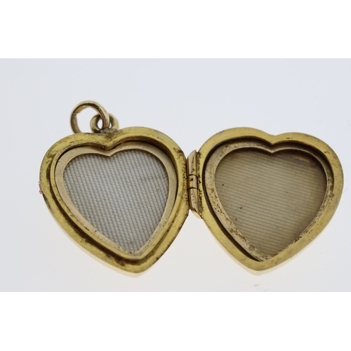 1093 - Hallmarked 375/9ct yellow gold opening heart locket with removable heart frames inside to allow phot... 