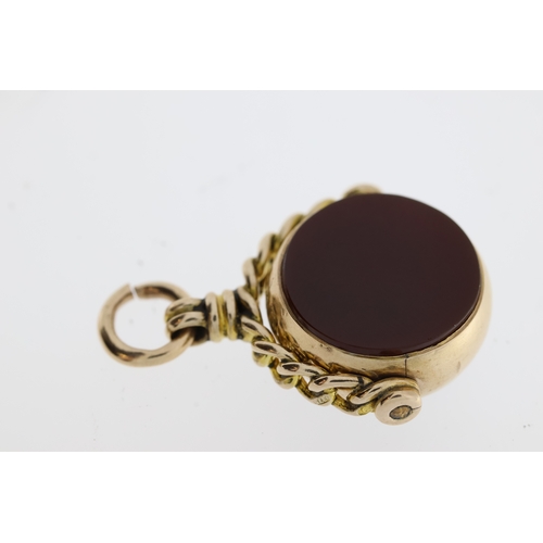 1099 - Marked with a full Birmingham hallmark a swivel fob comprising bloodstone and carnelian. Diameter of... 