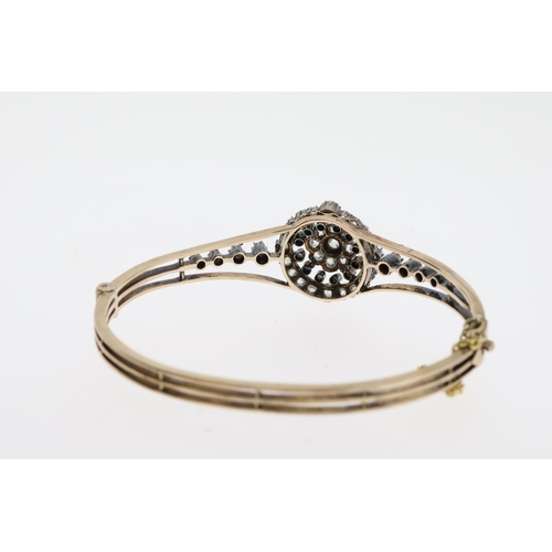 1103 - A late victorian old cut diamond bangle,comprising a dome target design with 4diamonds to each side.... 