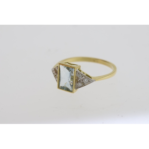 1108 - An Aqua ring with diamond shouldersAquamarine estimated to be 1 carat.18 carat gold