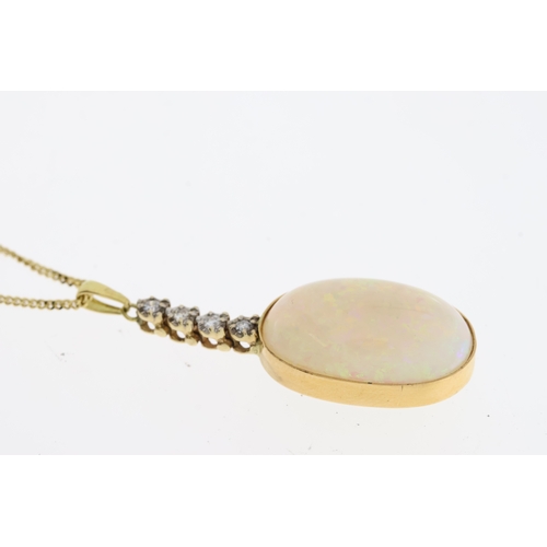 1111 - An oval Cabochon Opal sits in a gold settingbelow below 4 round diamonds suspended froma 16 inch gol... 