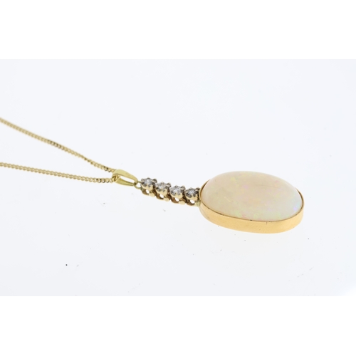 1111 - An oval Cabochon Opal sits in a gold settingbelow below 4 round diamonds suspended froma 16 inch gol... 