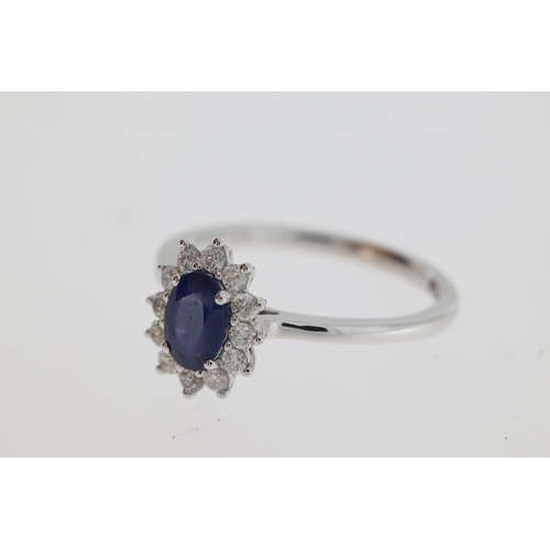 1116 - An oval sapphire and diamond ring.
Sapphire 0.56 carats, diamonds total 0.22 carats
18 carat white g... 