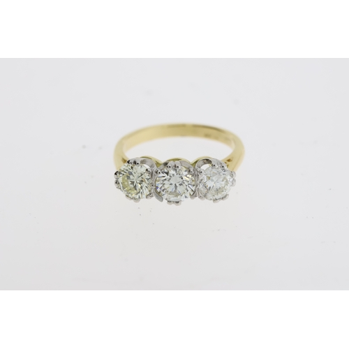 1118 - A round brilliant diamond 3 stone ring, the
diamond total is estimated at 2 carats. Stamped
18CT and... 