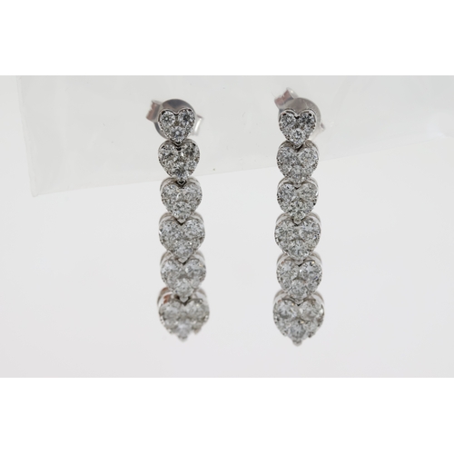 1122 - Six white metal pave set graduating hearts make
up this diamond drop earring pair. Just under
3cm in... 