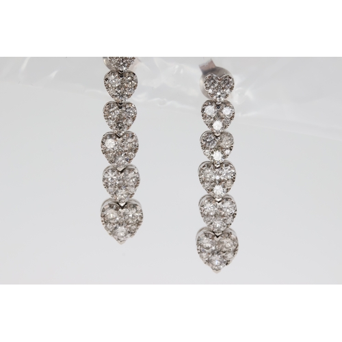 1122 - Six white metal pave set graduating hearts make
up this diamond drop earring pair. Just under
3cm in... 