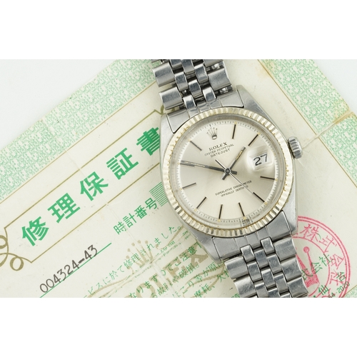 218 - ROLEX OYSTER PERPETUAL DATEJUST WHITE GOLD BEZEL W/ GUARANTEE PAPERS REF. 1601, circular silver dial... 