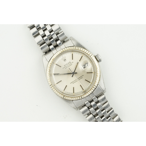 218 - ROLEX OYSTER PERPETUAL DATEJUST WHITE GOLD BEZEL W/ GUARANTEE PAPERS REF. 1601, circular silver dial... 