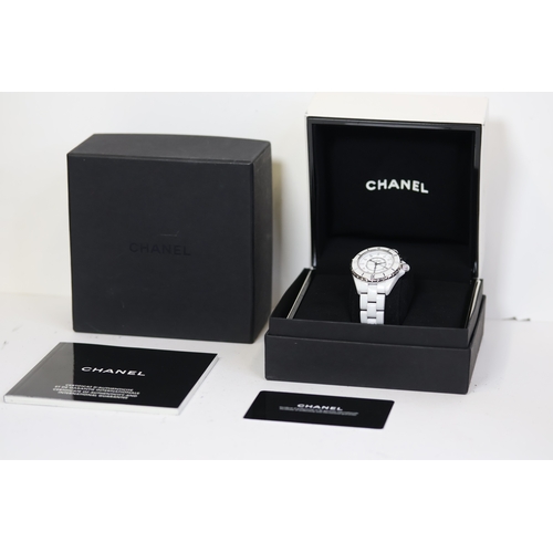 27 - CHANEL J12 QUARTZ WATCH W/BOX AND PAPERS 2006. Approx 34mm white ceramic case with a screw down case... 