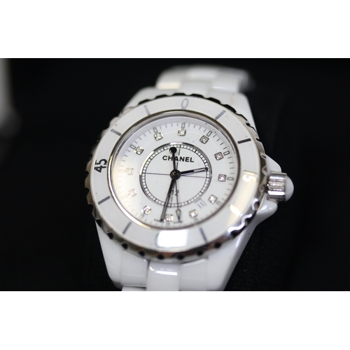 27 - CHANEL J12 QUARTZ WATCH W/BOX AND PAPERS 2006. Approx 34mm white ceramic case with a screw down case... 