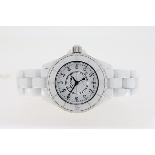 27 - CHANEL J12 QUARTZ WATCH W/BOX AND PAPERS 2006. Approx 34mm white ceramic case with a screw down case... 
