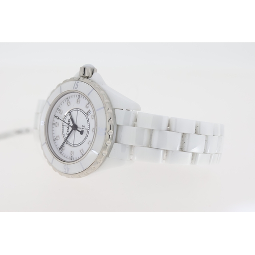 27 - CHANEL J12 QUARTZ WATCH W/BOX AND PAPERS 2006. Approx 34mm white ceramic case with a screw down case... 