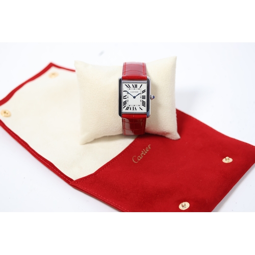 28 - CARTIER TANK SOLO LARGE REFERENCE 2715 WITH POUCH AND SERVICE PAPERS, square white dial with roman n... 