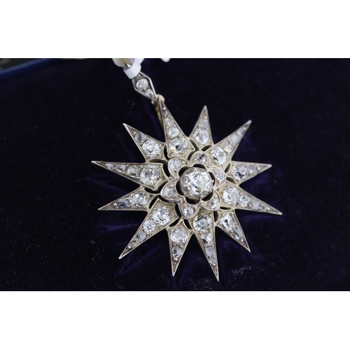 1013 - Edwadian white metal diamond star pendant. Old cut centre diamonds with rose cut diamonds. Total dia... 