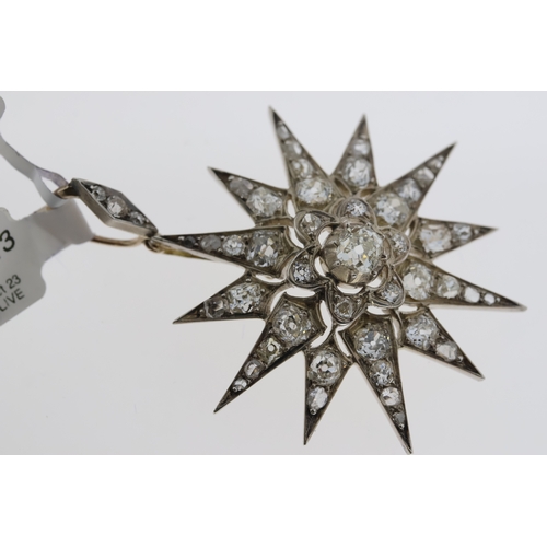 1013 - Edwadian white metal diamond star pendant. Old cut centre diamonds with rose cut diamonds. Total dia... 