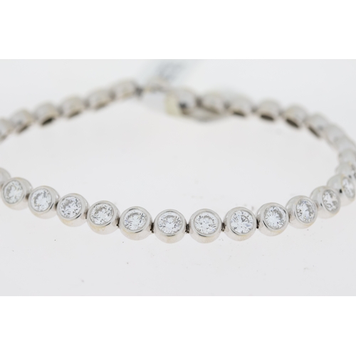 1014 - 8ct Diamond Line Bracelet, 18ct white gold rub over set round brilliant cut diamond line bracelet. T... 