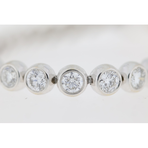 1014 - 8ct Diamond Line Bracelet, 18ct white gold rub over set round brilliant cut diamond line bracelet. T... 