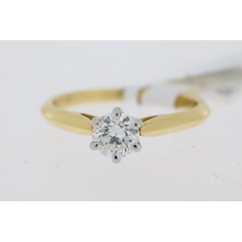 1022 - 18ct. yellow gold single stone diamond ring. Round brilliant cut diamond in a white 6 claw setting. ... 