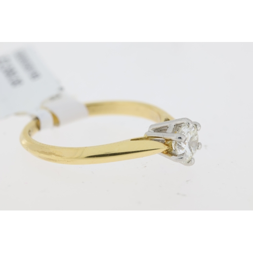 1022 - 18ct. yellow gold single stone diamond ring. Round brilliant cut diamond in a white 6 claw setting. ... 