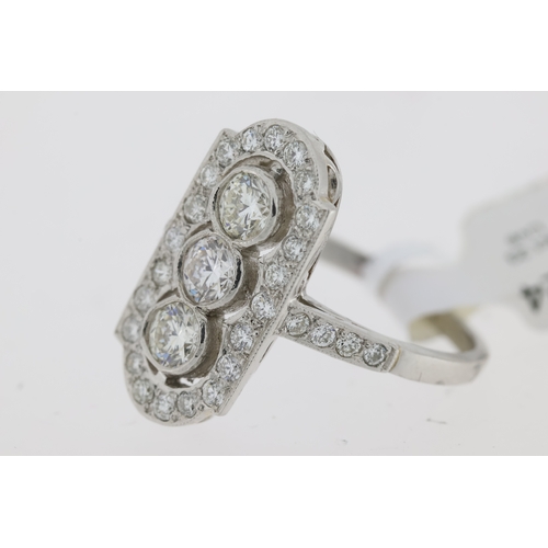 1024 - 1.30ct Diamond Panel Ring, Platinum 3 stone diamond cluster ring with diamond set shoulders.  Approx... 