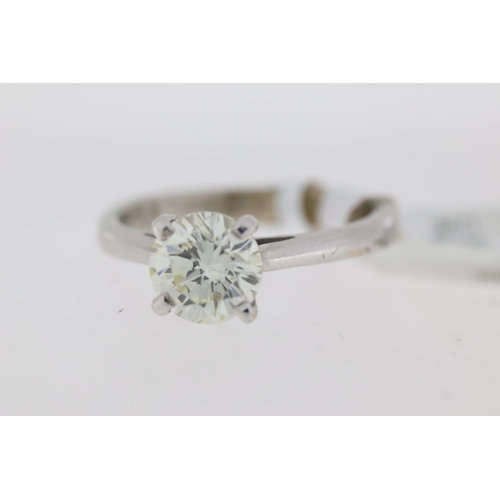 1027 - 18ct white gold round brilliant diamond solitaire claw set ring. Approximate diamond carat weight 1.... 