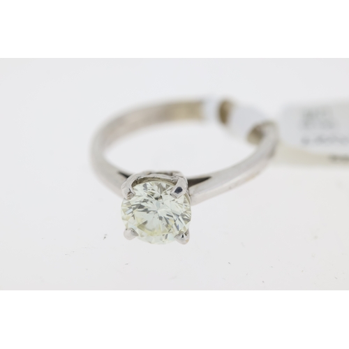 1027 - 18ct white gold round brilliant diamond solitaire claw set ring. Approximate diamond carat weight 1.... 