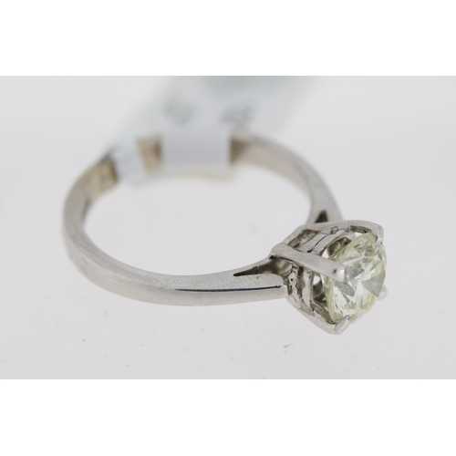 1027 - 18ct white gold round brilliant diamond solitaire claw set ring. Approximate diamond carat weight 1.... 