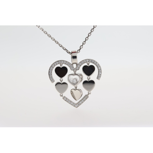 1033 - Chopard 18ct white gold Happy Amore diamond pendant with a moving diamond and chain.
Approximate tot... 