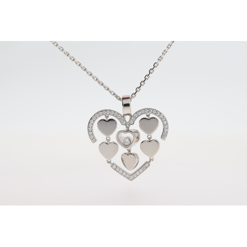 1033 - Chopard 18ct white gold Happy Amore diamond pendant with a moving diamond and chain.
Approximate tot... 