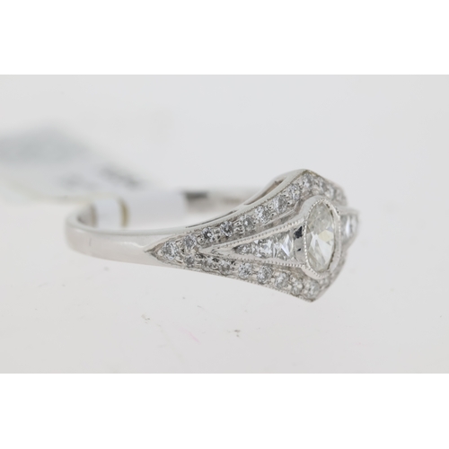 1034 - Platinum vintage inspired diamond ring. Oval centre old cut rub over set diamond. Grain set french c... 