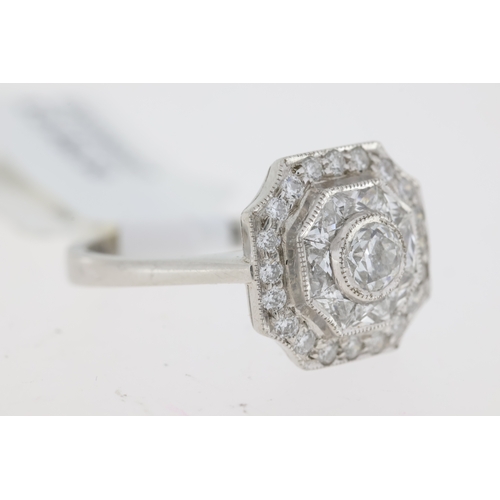 1036 - Platinum octagonal vintage inspired diamond ring. Centre rubover set old cut diamond 0.46ct. Rubover... 