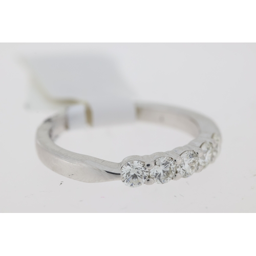 1038 - 18ct White gold diamond set half eternity ring., 5 stones, Diamond carat weight 0.47-0.55ct.