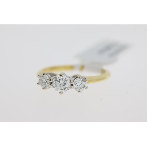 1041 - 18ct Yellow gold and white gold three stone round brilliant diamond ring.  Estimated total diamond w... 