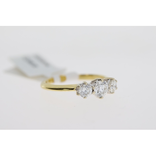 1041 - 18ct Yellow gold and white gold three stone round brilliant diamond ring.  Estimated total diamond w... 