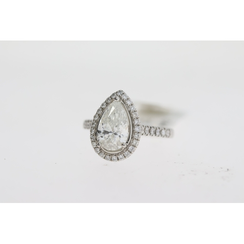 1044 - 1.80ct Platinum pear cut diamond solitaire ring with diamond halo and shoulders. Centre stone weight... 