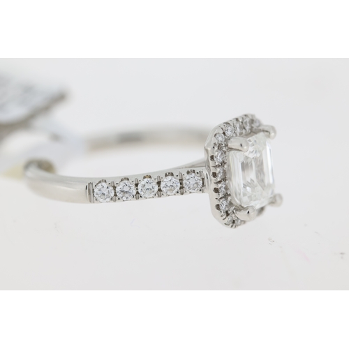 1046 - 1.01ct GIA F colour Emerald cut diamond ring with diamond set halo and shoulders. Emerald cut diamon... 