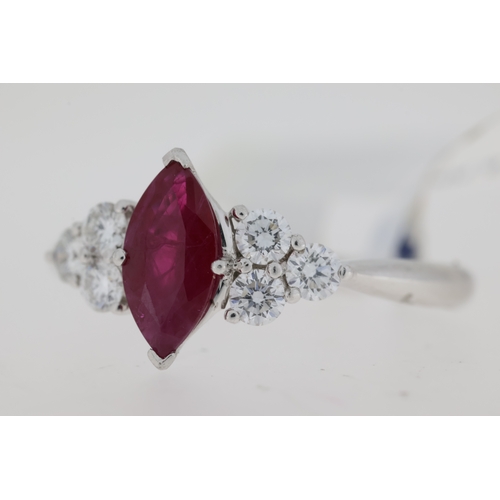 1049 - Platinum marquise cut ruby ring with three brilliant cut diamonds set at each side. Approximate ruby... 