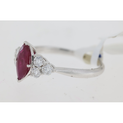 1049 - Platinum marquise cut ruby ring with three brilliant cut diamonds set at each side. Approximate ruby... 