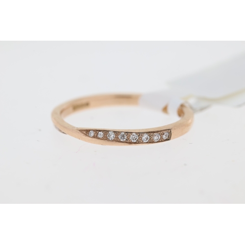 1050 - 9ct rose gold diamond set twist wedding band. Approximate total diamond weight 0.17ct.