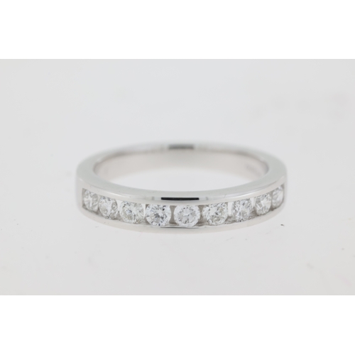 1053 - Platinum diamond channel set ring. Approximate total diamond weight 0.50ct.