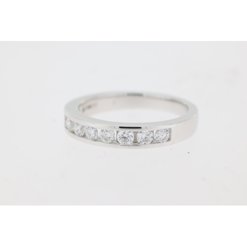 1053 - Platinum diamond channel set ring. Approximate total diamond weight 0.50ct.