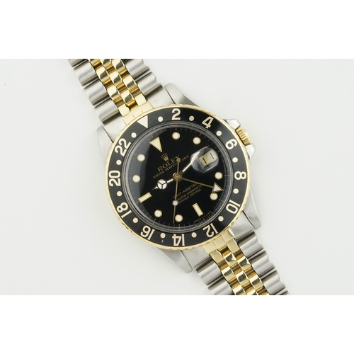 155 - ROLEX OYSTER PERPETUAL DATE GMT-MASTER STEEL & GOLD REF. 16753 CIRCA 1987, circular black dial with ... 