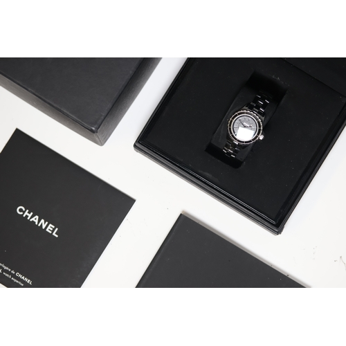 24 - LADIES CHANEL J12 CERAMIC WITH BOX, Approx 29mm black ceramic case with a screw down case back. Fixe... 