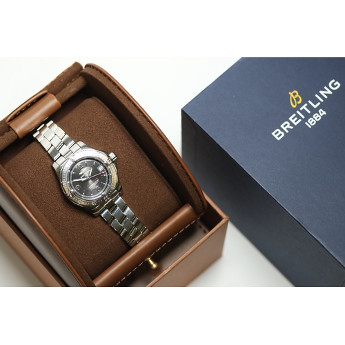 48 - LADIES BREITLING COLT OCEANE REFERENCE A77380 WITH BOX, circular black dial with baton and arabic nu... 