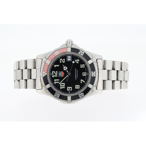 TAG HEUER PROFESSIONAL REFERENCE WM1112 circular black dial with arabic numeral hour markers quick