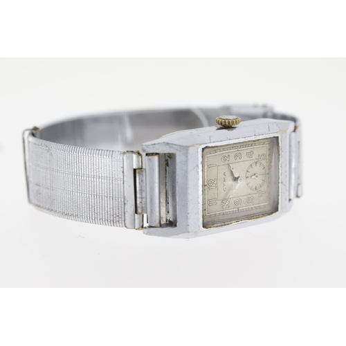 16 - Brand: Vintage Cyma
 Movement: Manual Wind
 Dial shape: Square
 Dial colour: Grey
 Dial features: Se... 