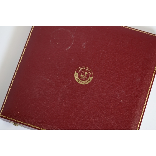 91 - Brand: STATE OF QATAR BOX
Model Name: *To BE SOLD WITHOUT RESERVE*
A red leather bound sqare case wi... 